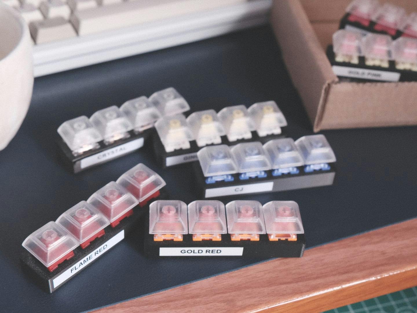 View of many Milktooth switch testers and a box in the background